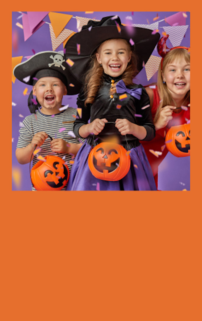Happy children in Halloween costumes.