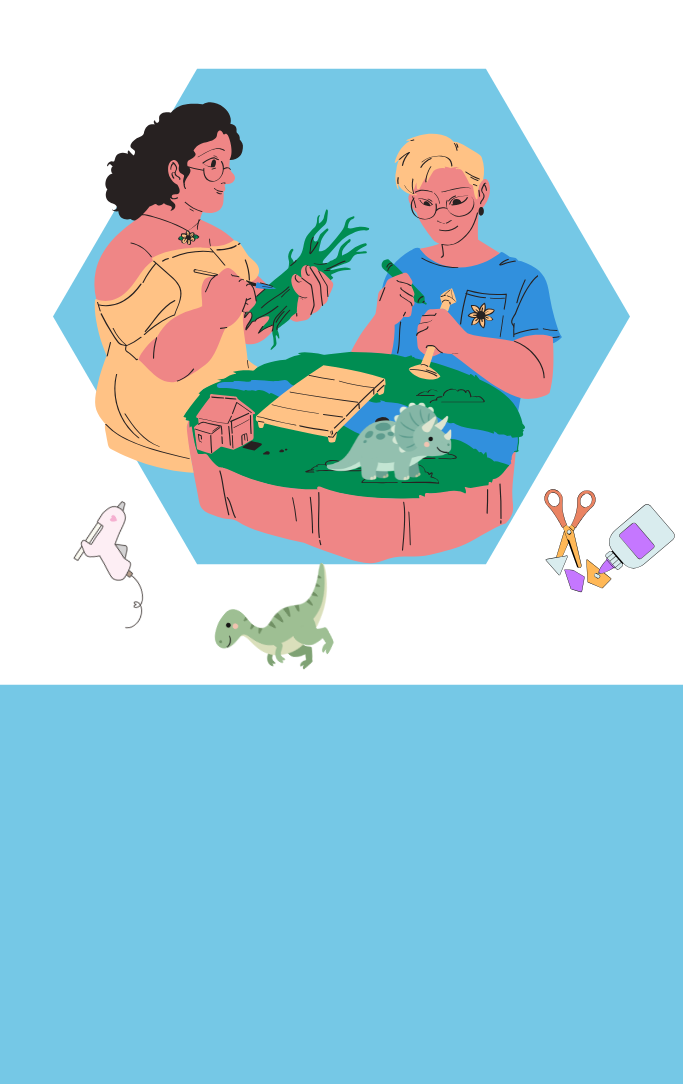 Two women work on a diorama featuring a dinosaur and a little river.
